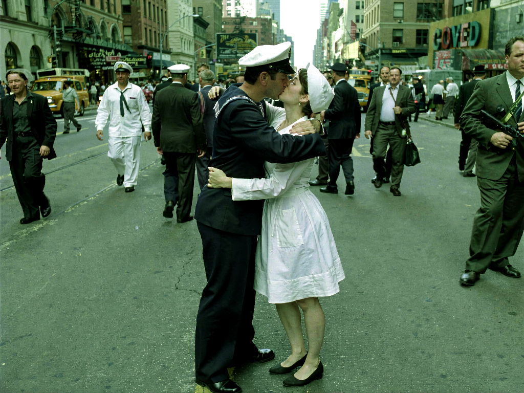 Klein LoRA image-to-image output named Green Signal, a sailor and nurse kissing on a city street under a green-tinted grade.